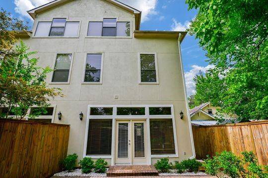 A view of the back of your home shows the  french doors & many windows!