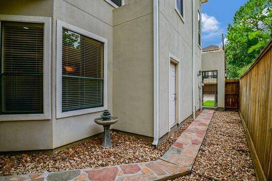 A paved walk way leads from the front entry to the back patio.