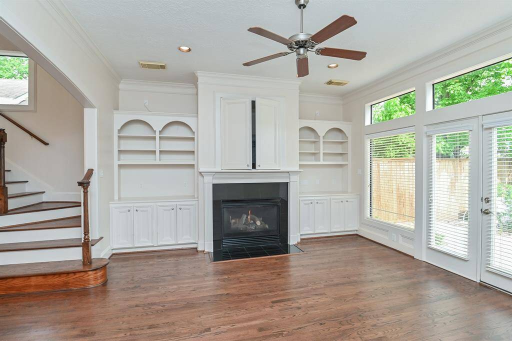 Built in custom cabinets in the living area surround a gas fireplace to enjoy on cool winter evenings.