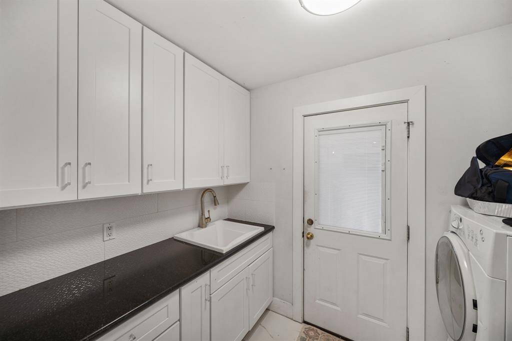 Laundry room with extra sink and storage space