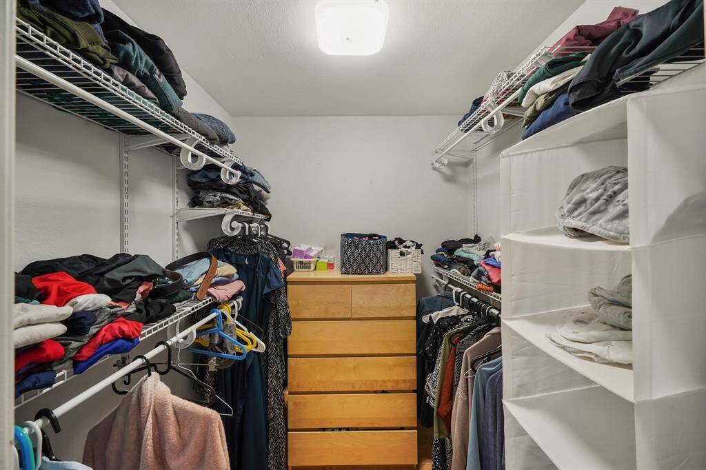 Primary Bedroom walk in closet