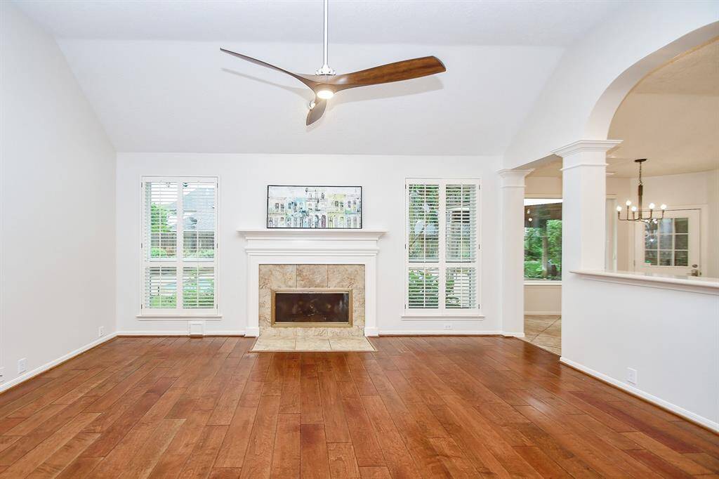 The fireplace takes center stage in the Family Room with amazing view of the Backyard too!
