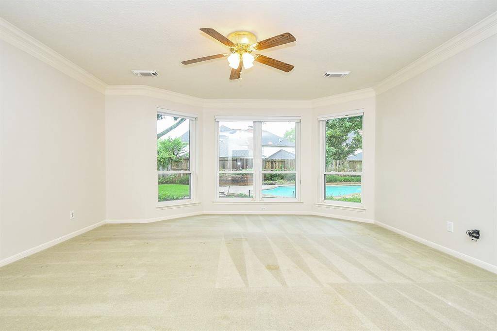 Huge Primary Bedroom on the 1st floor with amazing views of the Backyard Paradise!