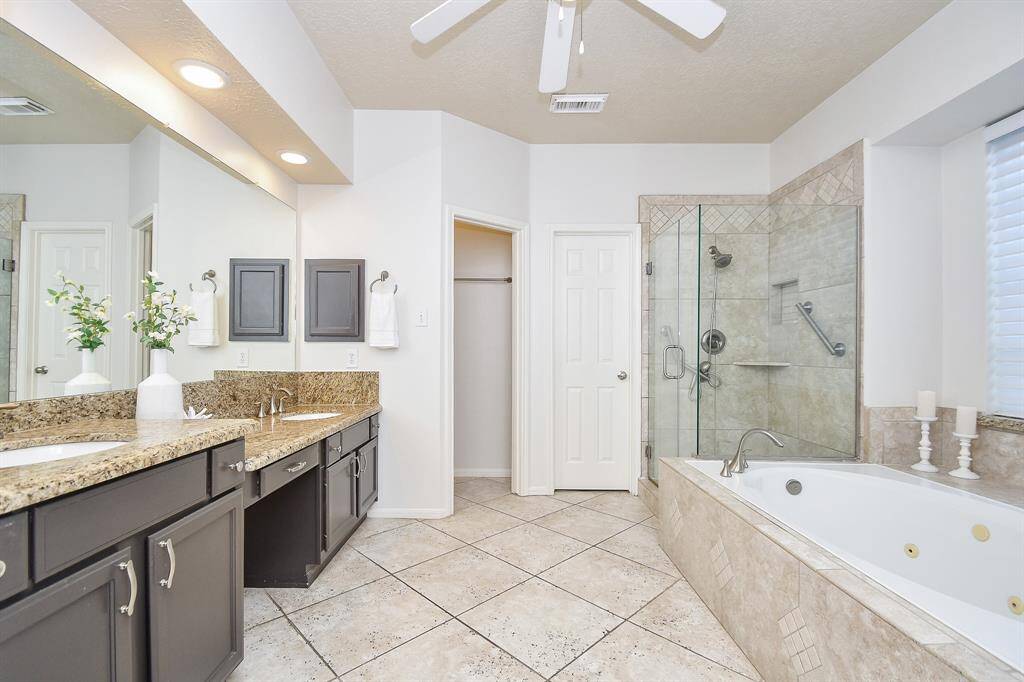 Primary Bathroom has granite counters plus a jetted tub and separate shower!