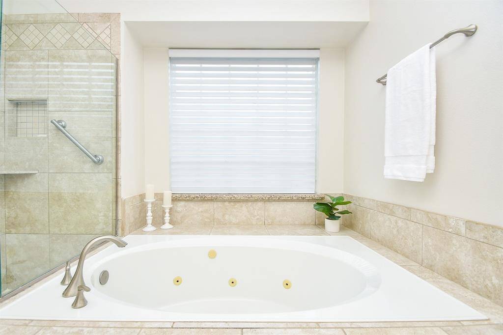 Huge Jetted Tub with a decorator shelf behind it!