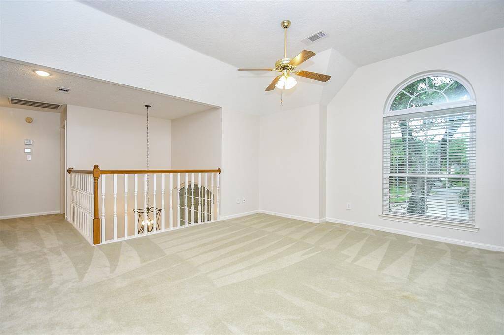 Large Family Room with a ceiling fan!