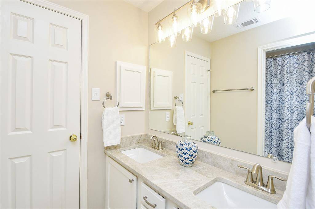 This is the 3rd full bathroom located between Between Bedroom 3 & 4.