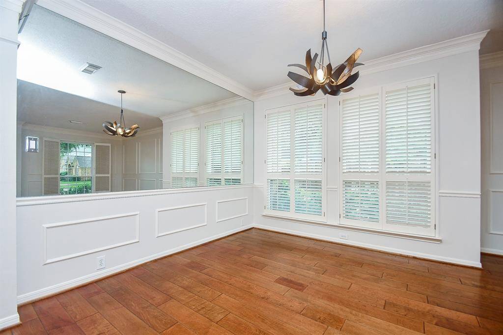 Dining Room includes custom shutters and an upscale Fixture!