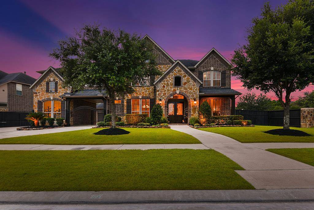 Show stopper!  This yard has been meticulously maintained.  Landscape lighting in the front and back, as well as sprinkler system.