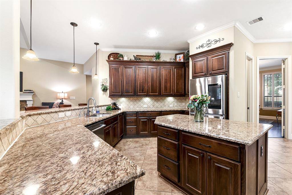 Tons of cabinets for storage, under cabinet lighting as well as a large walk in pantry.