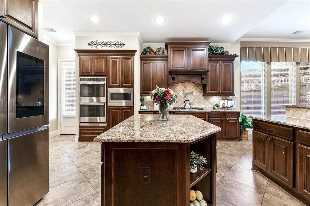 Double oven, gas cook top and pot filler are a few more features to this chef's kitchen!