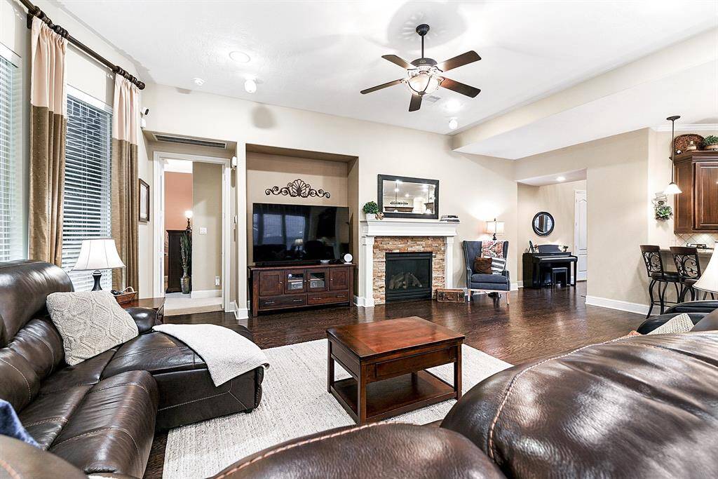 The family room features a cozy gas log fireplace-perfect for those "rare" cold Texas nights.