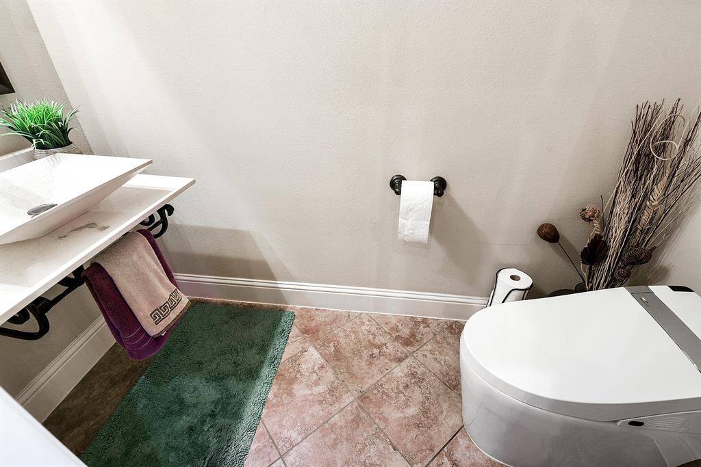 A half bath is located between the entry and family room.  A bidet toilet has been added.