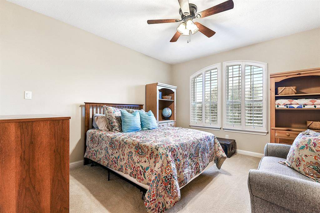 All the additional bedrooms are located upstairs.  The ones at the front of the home have plantation shutters.  All have ceiling fans and walk in closets, as well as a personal full bath attached.