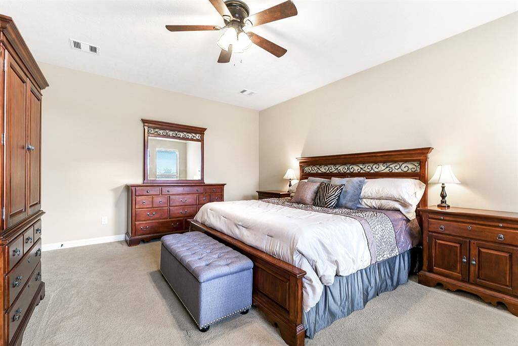 This bedroom has an entryway to it, and is the largest of the secondary bedrooms.  It has the largest walk in closet with a window.