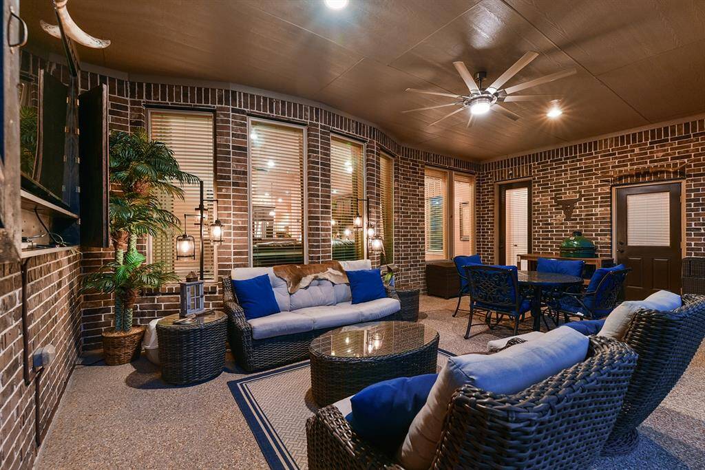 Wind down on the covered patio.  Ceiling fans, outdoor tv/with wood cover and half bath off the patio.