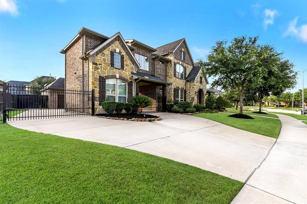 Plenty of room for parking!  Pull in through one of the electric gates and park under the porte cochere or one of the 3 car garages.