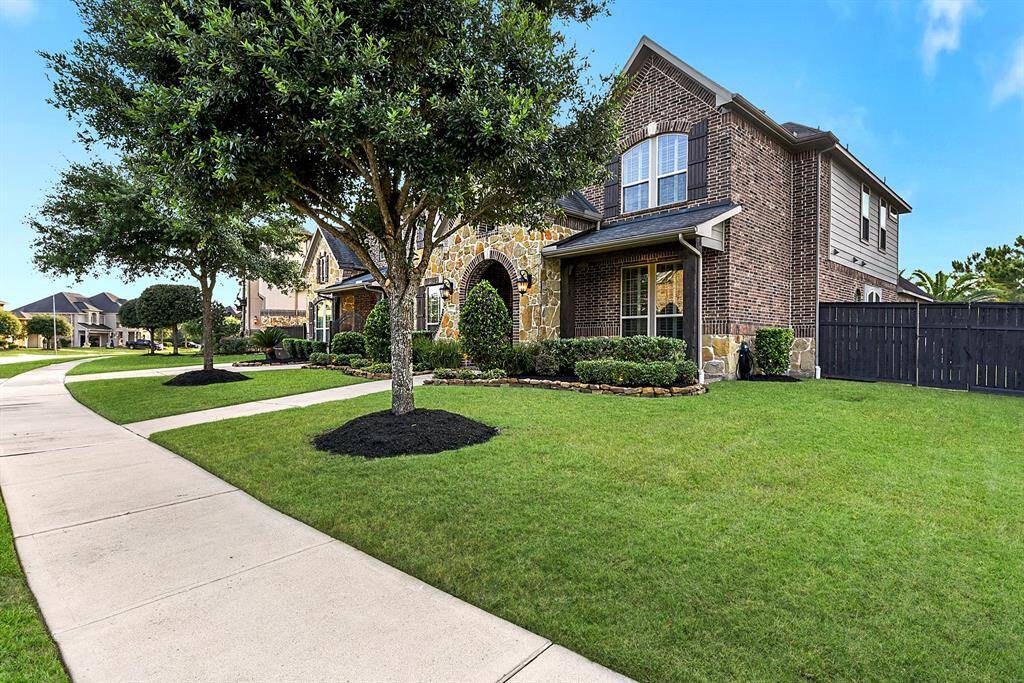 This beauty is located on a corner lot.  Nice side yard in front and back.