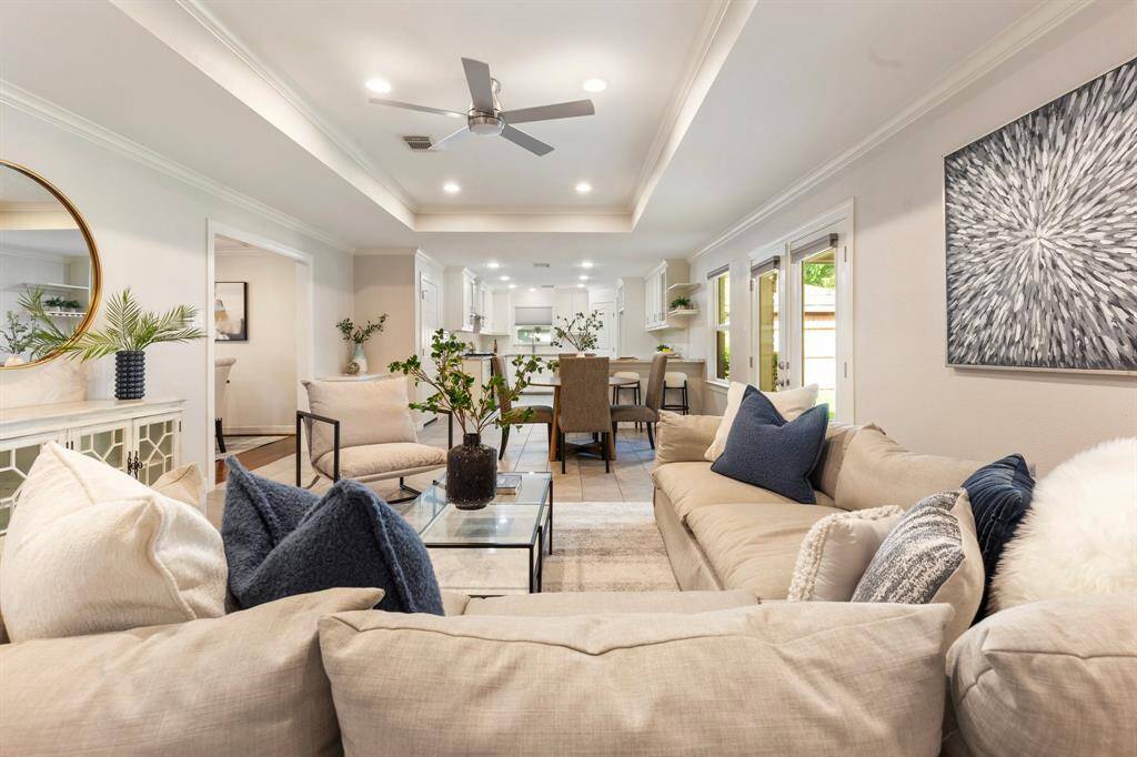 Enjoy the informal living room, which opens to the patio, breakfast area, and kitchen