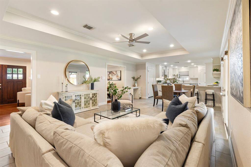 Such an open and inviting home! The living room includes a stunning coffered ceiling