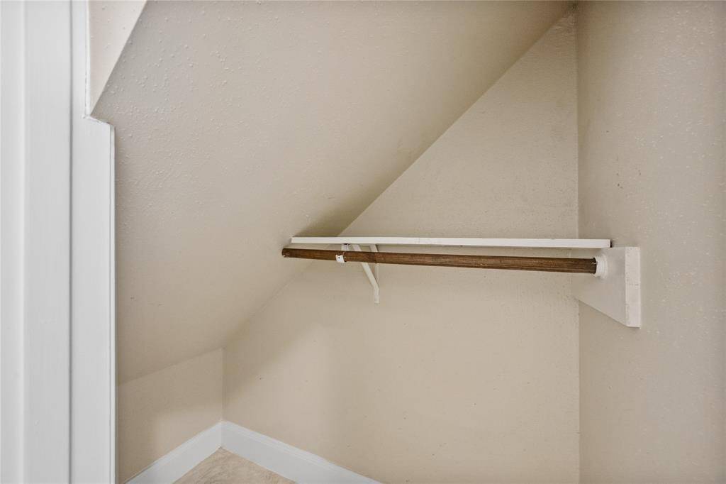 Extra storage nook under the stairs.