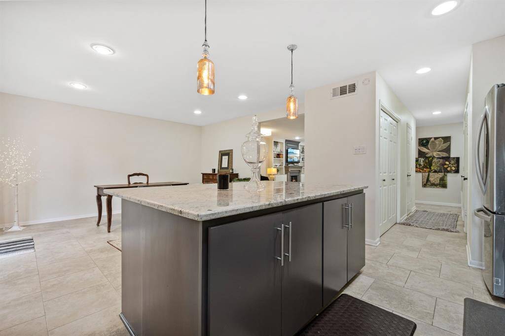 Updated kitchen with modern cabinets and fixtures.