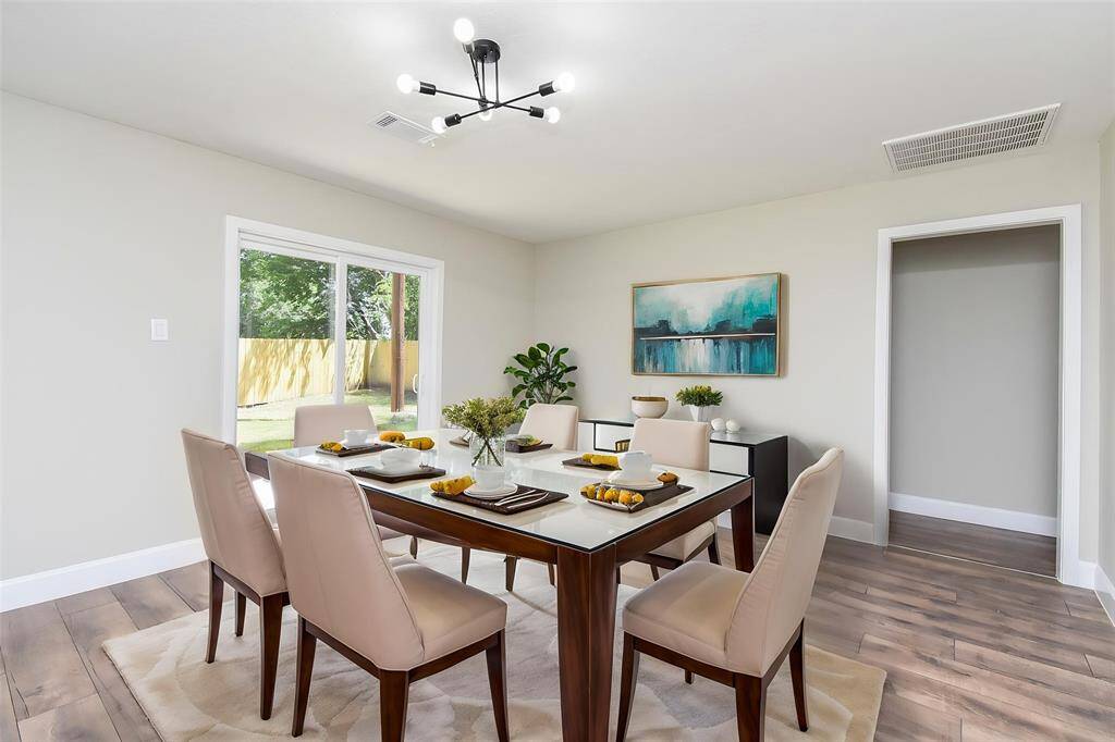 The large sliding door gives immediate access to the backyard and allows ample natural lighting to flow through the room.