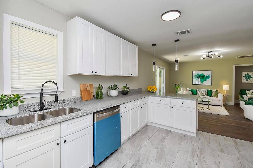 The crisp, white cabinetry provides ample storage and gives a beautiful modern feel.