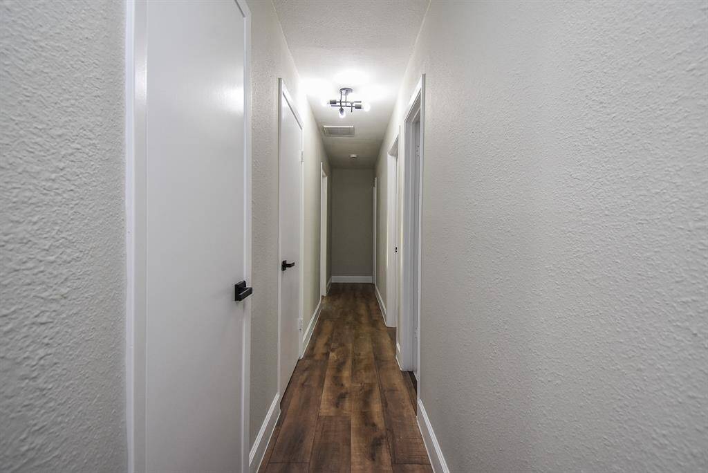 Walk down this efficient hallway that leads to the rooms.