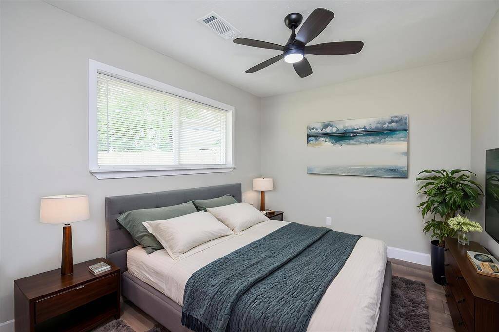 Notice the neutral toned walls and a huge window that gives a great view of the backyard.