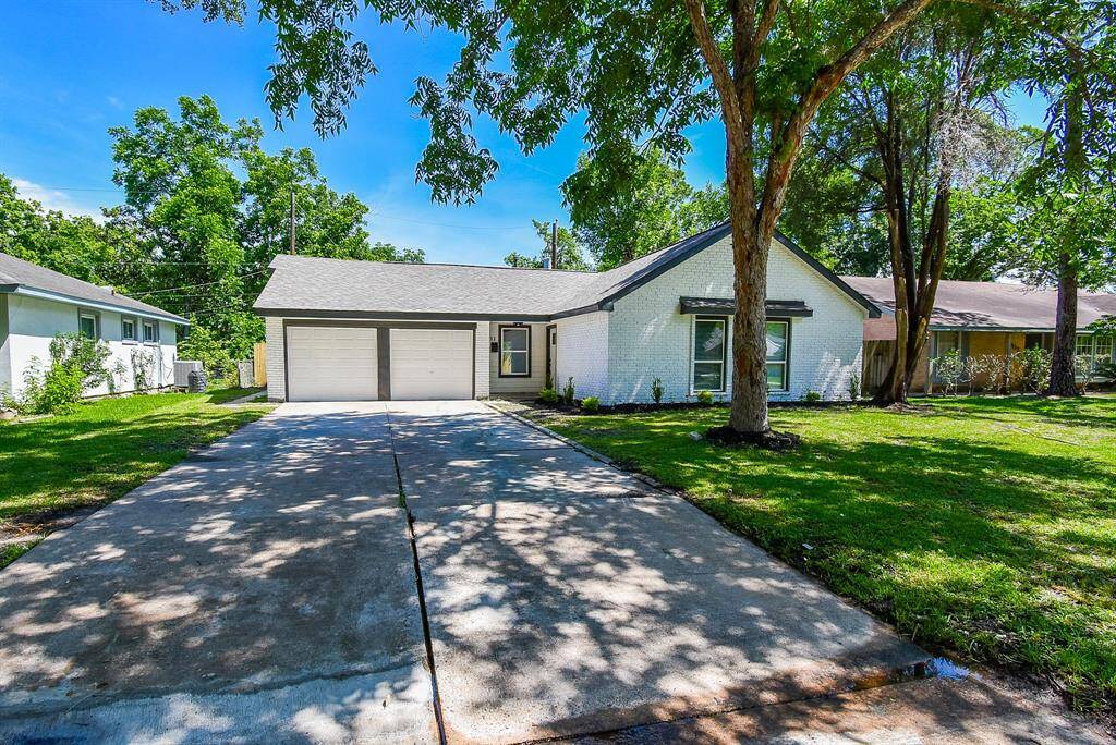 Notice the covered porch, and a well-maintained lawn?