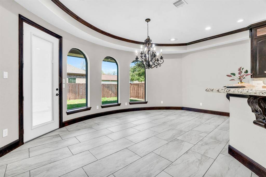 This Dining Space features large windows to allow in natural lighting! 5912 T St., Katy, TX  77493