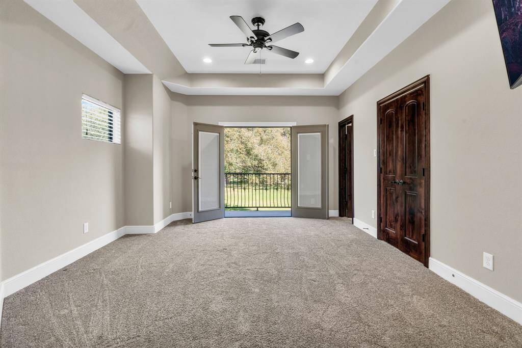 Secondary Bedroom Upstairs with Coffered Ceilings, Ceiling Fan & a Private Balcony! 5912 T St., Katy, TX  77493