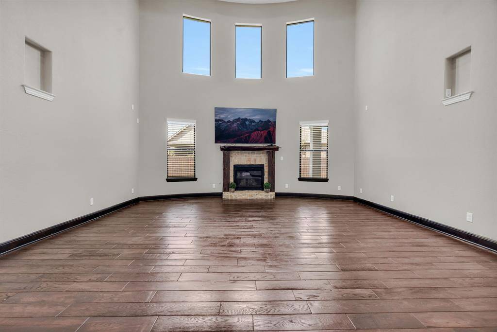 This living room is centrally situated overlooking the kitchen and dining area for your after-dinner conversations! 5912 T St., Katy, TX  77493