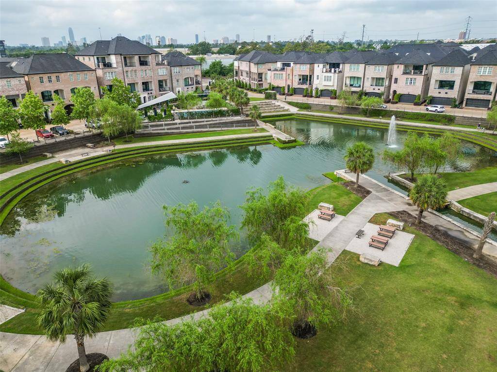 Large lake with fountain and walking trails