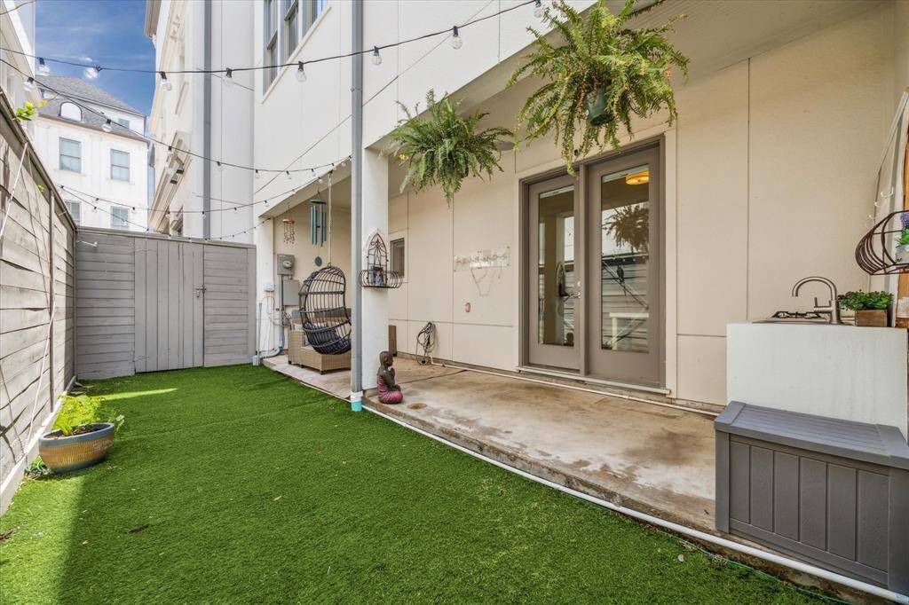 Spacious back yard with turf for easy maintenance! You will love relaxing under the covered patio!