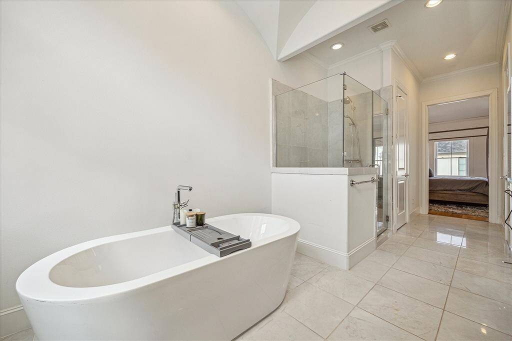 Soaking tub and separate primary shower.