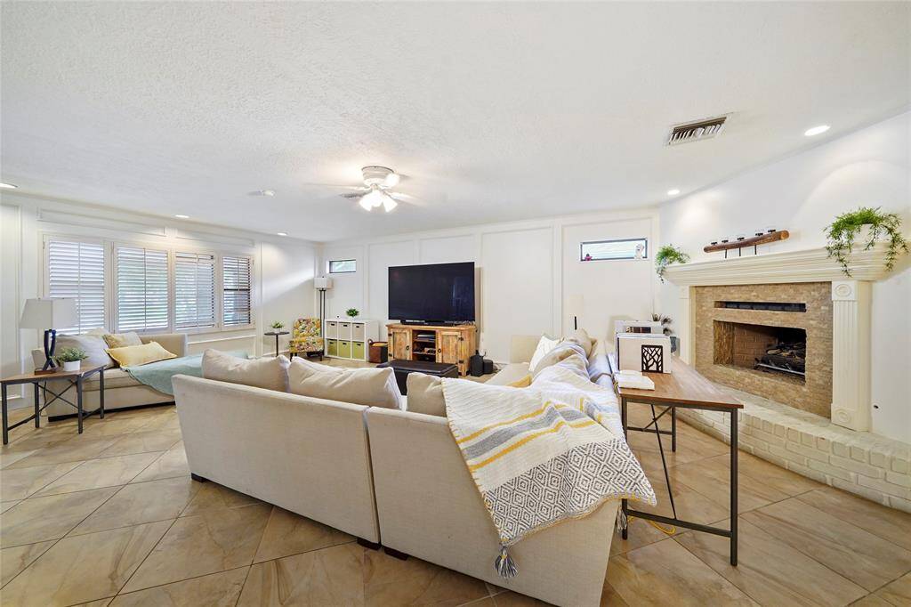Note the recessed lighting and beautiful fireplace.