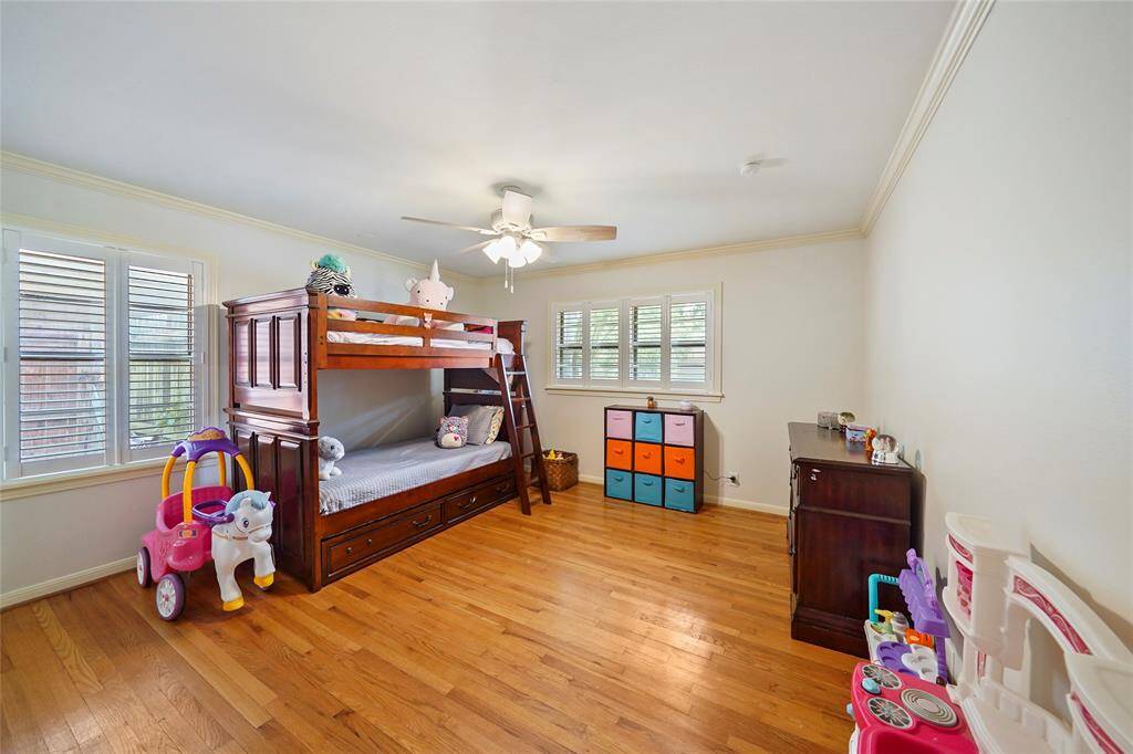 The first of your secondary bedrooms is located at the front of the home and features large closets and solid wood floors.