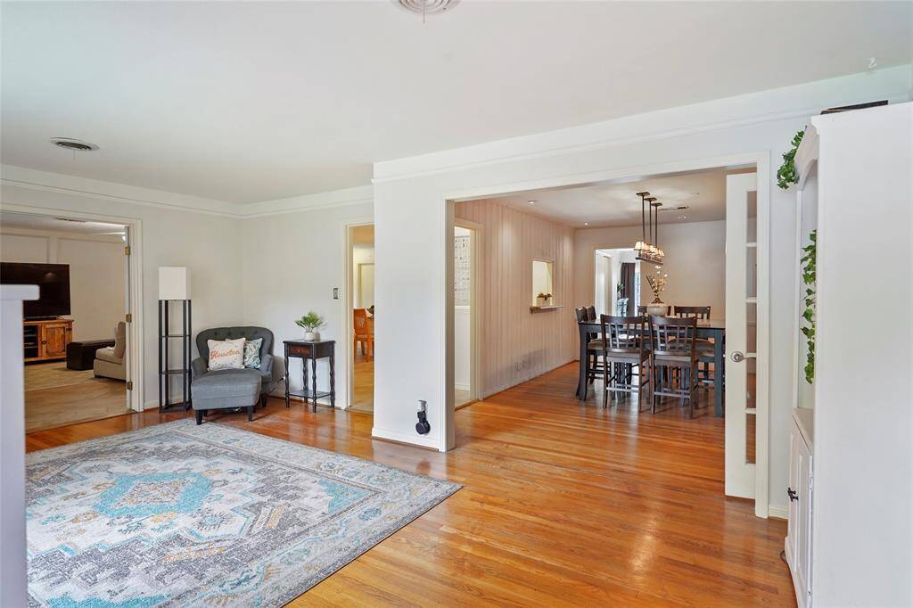 From this angle, you can see into the formal dining room from the opening on the right, the kitchen from the middle and the spacious open concept living room on the left.