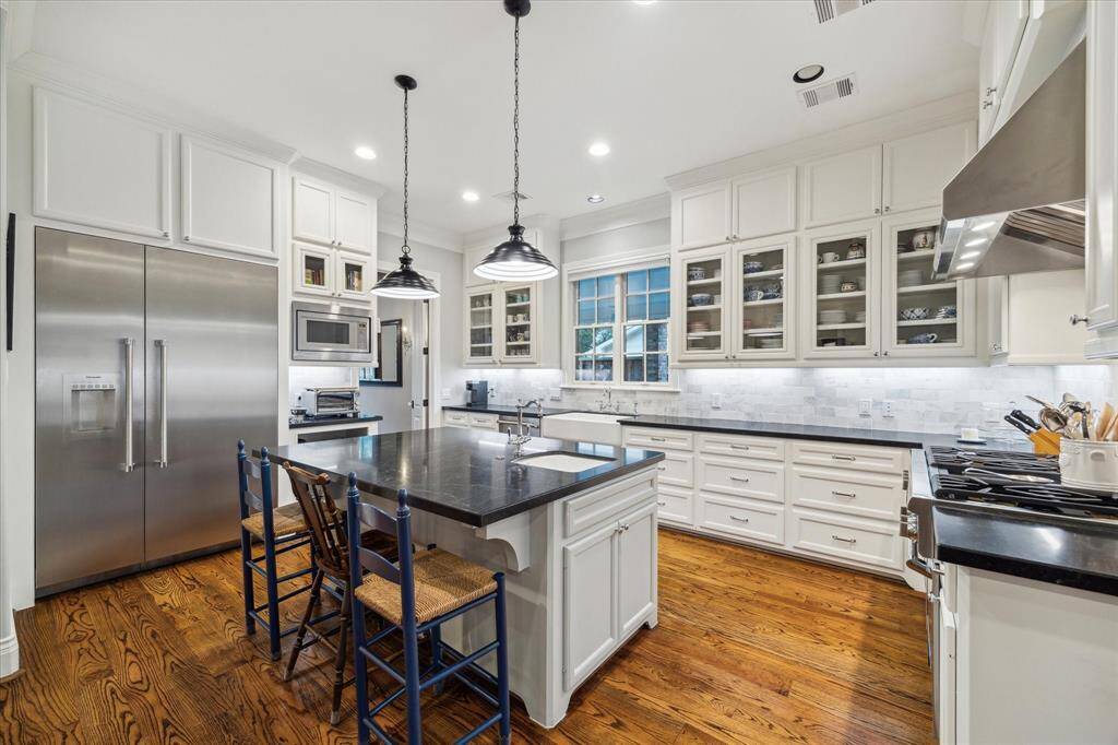 With ample cabinetry, the kitchen provides exceptional storage for all your culinary essentials.