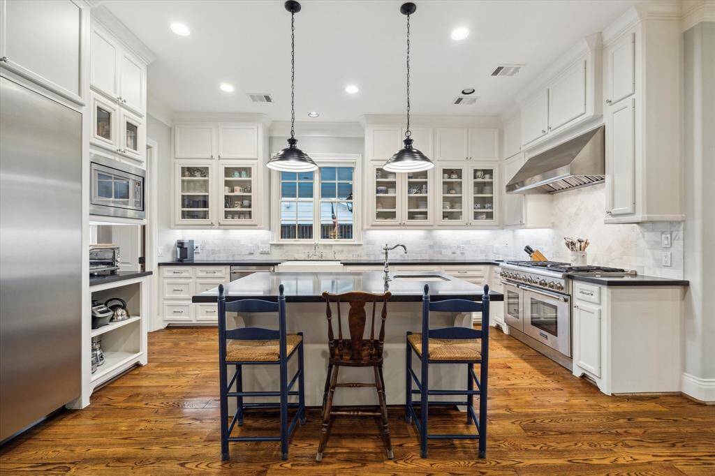 The kitchen features a spacious center island, perfect for meal prep, casual dining, and gathering with family and friends.