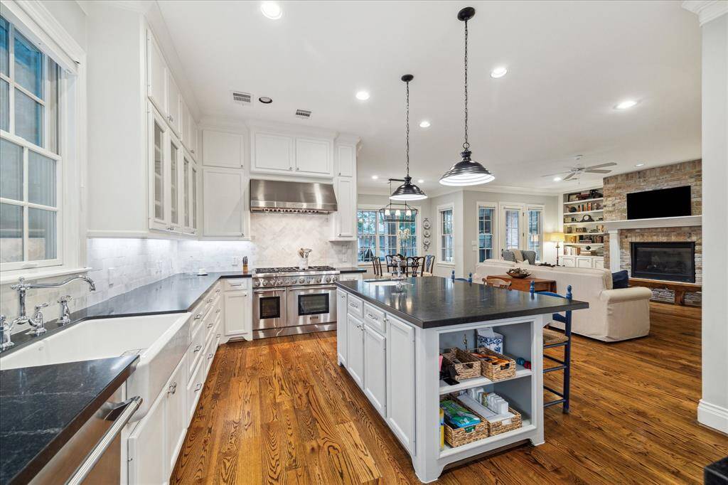 Outfitted with high stainless steel Thermador 48” range with dual ovens, Thermador dishwasher, and Thermador doubled door refrigerator and freezer.