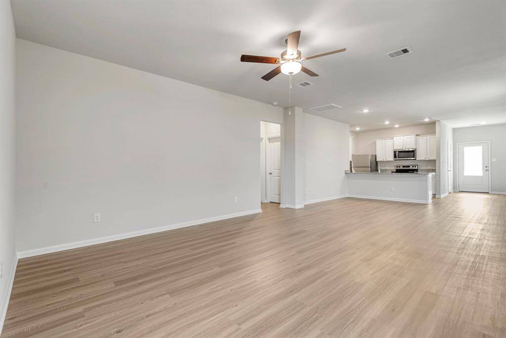 The open concept in the living room offers plenty of space to gather with your family and friends.
