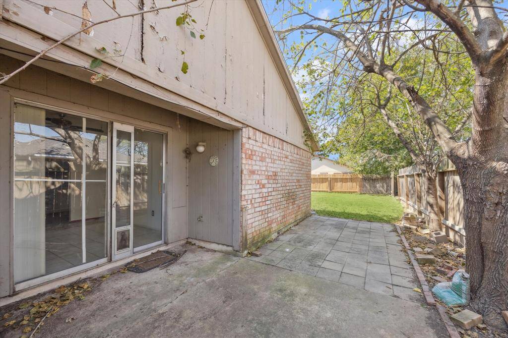 Private backyard, fully fenced, providing a secure space for outdoor activities and relaxation.