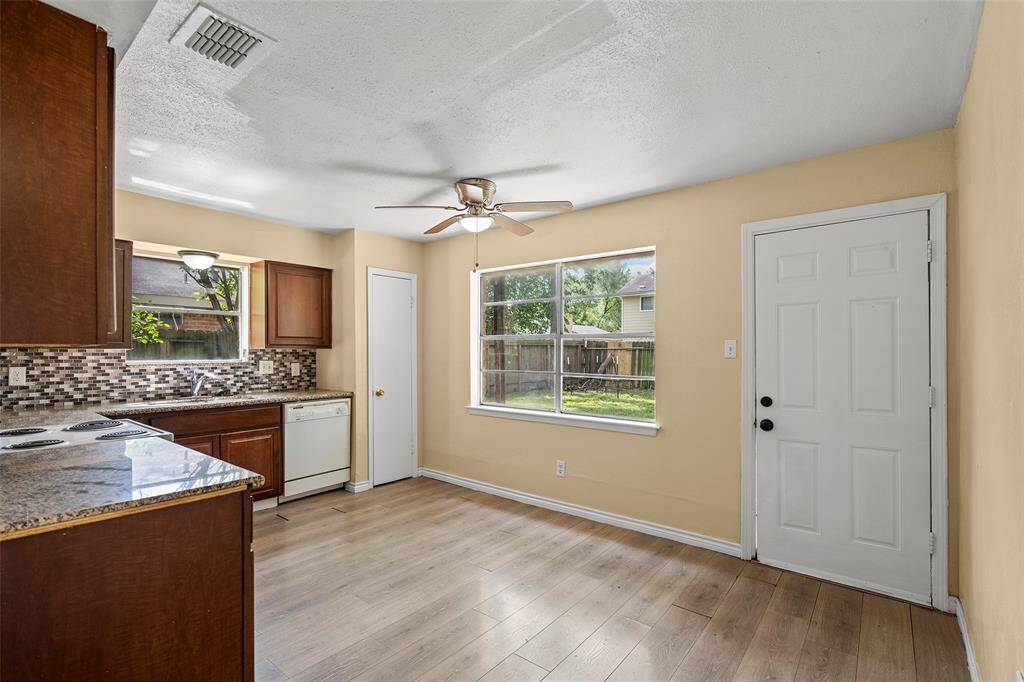 In the kitchen is a breakfast nook area with windows that have views of the backyard. A great spot to enjoy that morning cup of coffee.