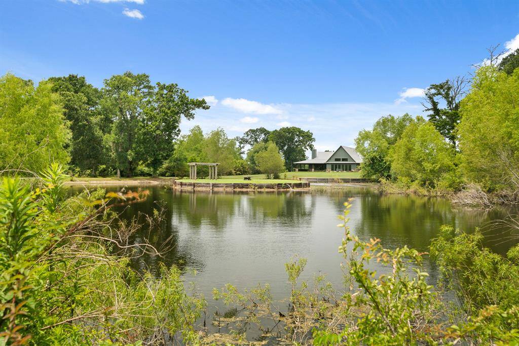 The huge pond is not only a gorgeous setting where both sunlight and moonlight reflect off the water. Designed for entertaining, a bridge provides a welcoming walkway to the Island that includes a large arbor and an ideal spot for fishing. It is a year-round sanctuary for an abundance of wildlife too.