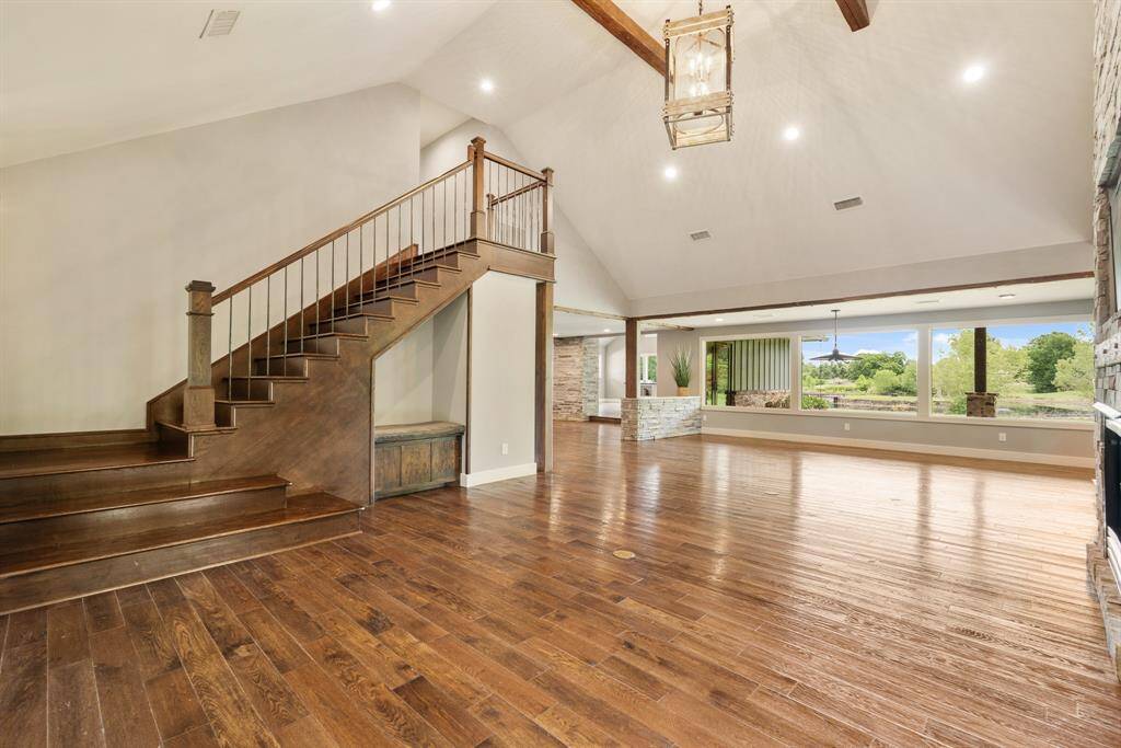 This is looking back towards the Dining Room and captures how the expansive wall of glass floods the space with both an abundance of natural light and stunning views.