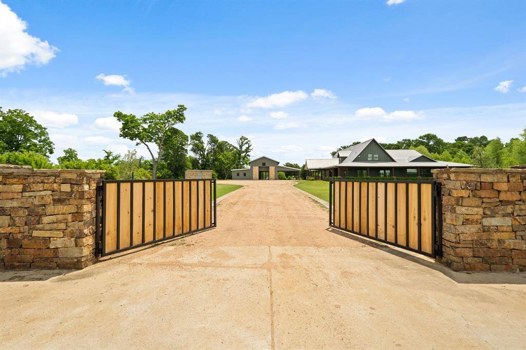 A stately stone entrance with automatic gate provides a welcomed escape from the City and access to very best that fine country living offers. An extra wide crushed granite driveway provides easy access to both the home and the extraordinary Barn with ample turning space for oversized vehicles.