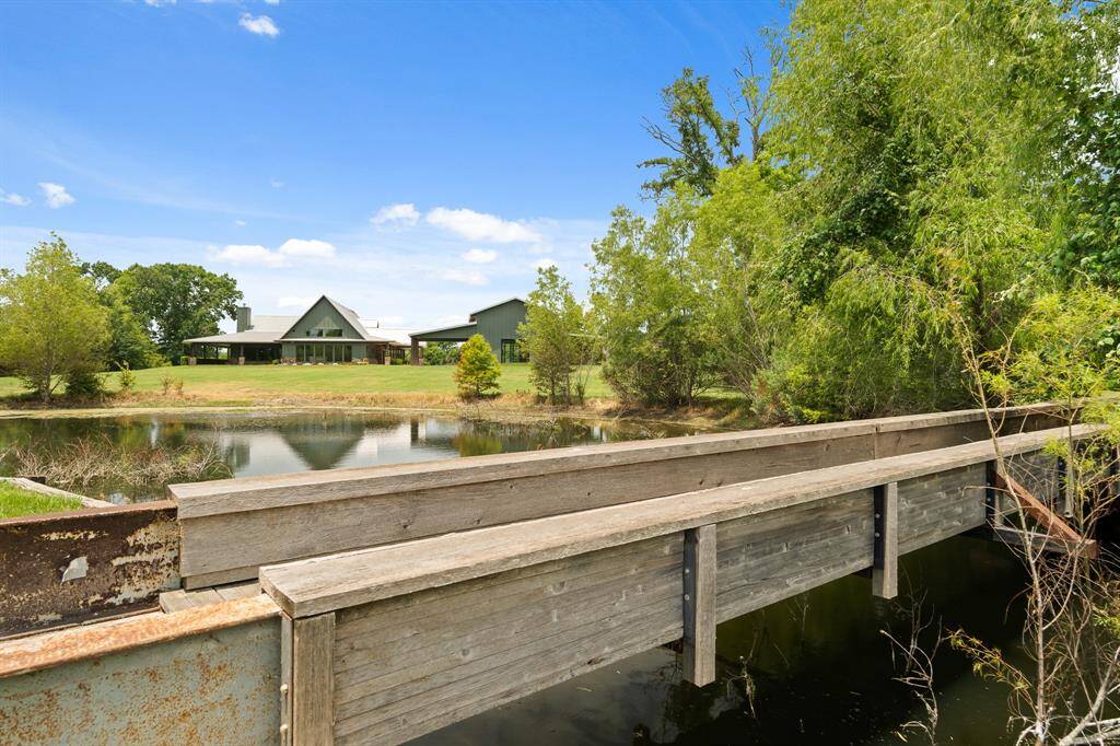 A quaint, foot bridge is superbly constructed out of a pair of metal I-beams that provides access to this remarkable Island that is also thoughtfully bulkheaded.